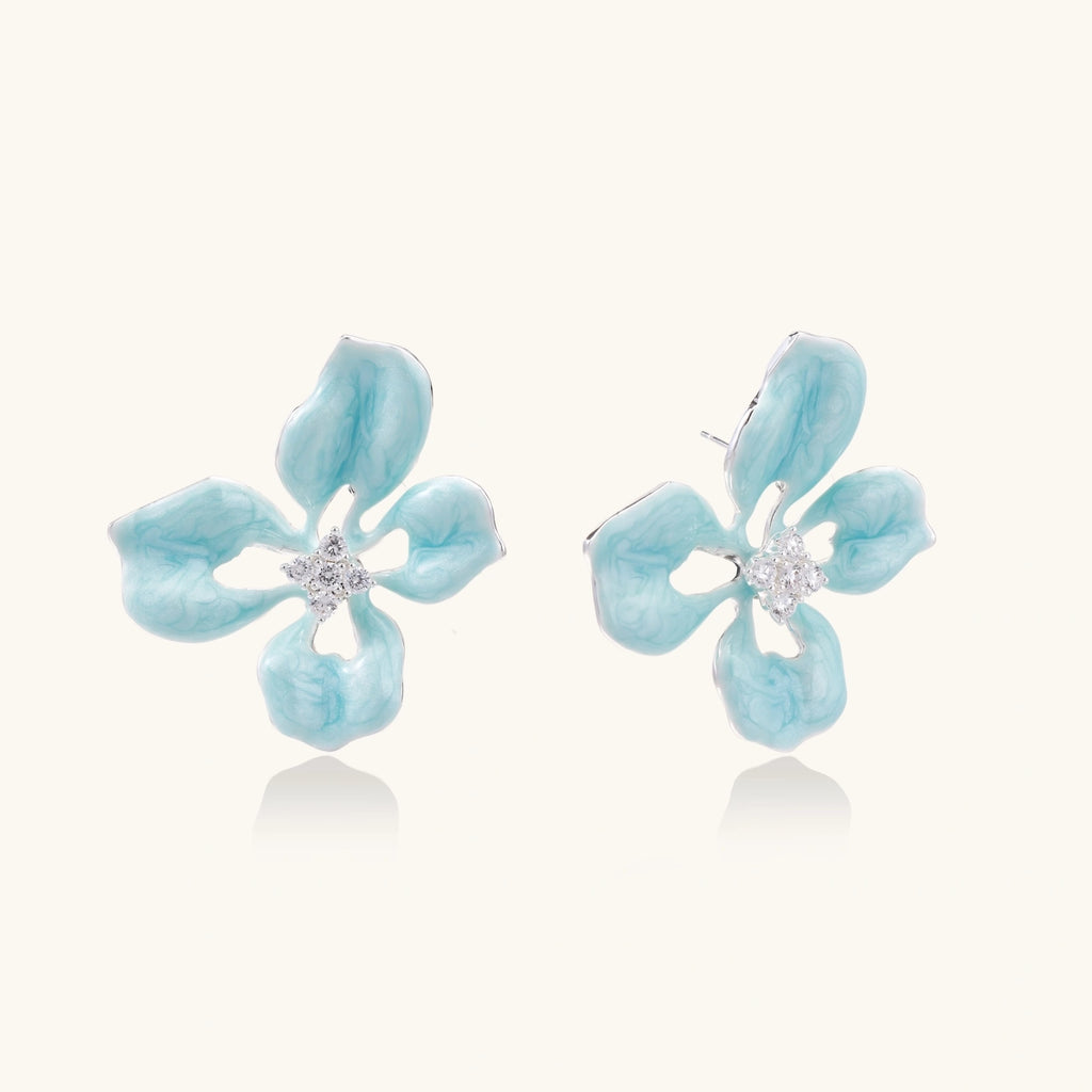 Turquoise enamel flower stud earrings with marbled finish and crystal centers on 18K gold plated brass