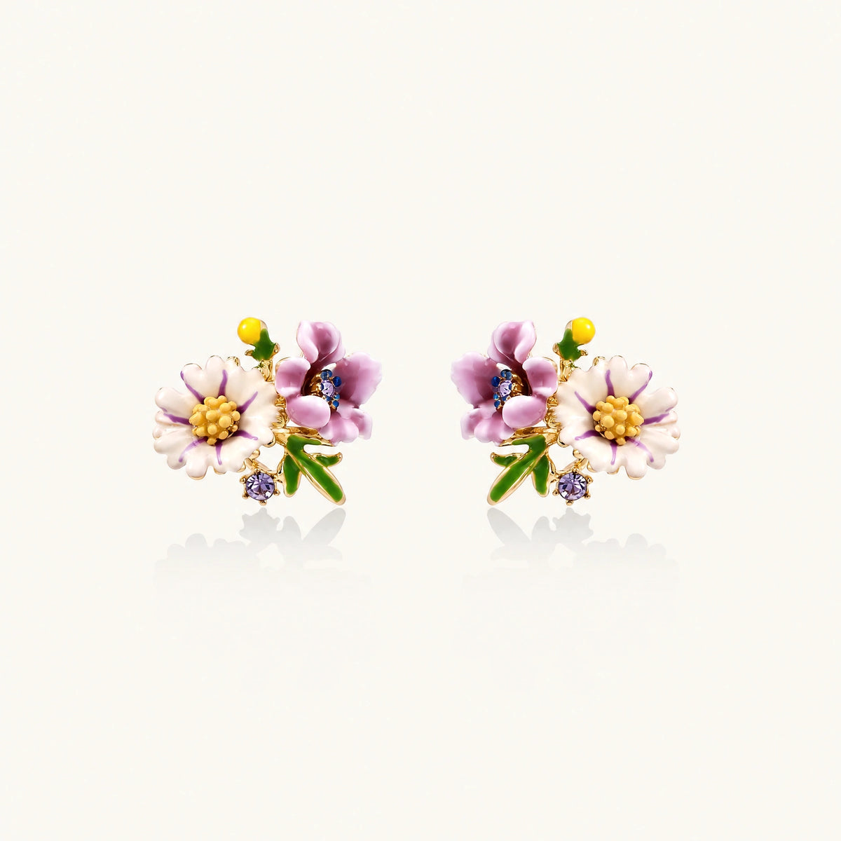Cluster-style stud earrings with purple pansies, white daisies, yellow centers, and green leaves in glossy enamel finish