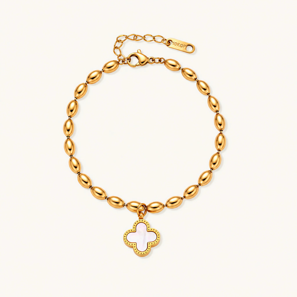 18K gold-plated oval bead bracelet with a four-leaf clover charm in mother-of-pearl or black enamel, adjustable lobster clasp, on white background.