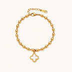 18K gold-plated oval bead bracelet with a four-leaf clover charm in mother-of-pearl or black enamel, adjustable lobster clasp, on white background.