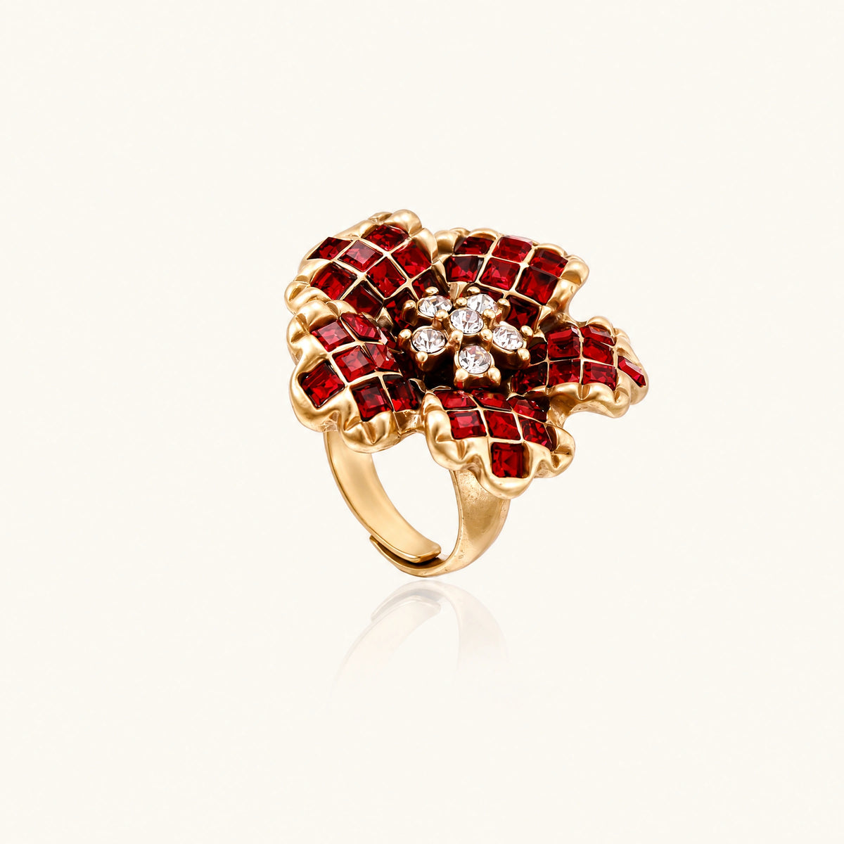 Gold-plated brass ring with red zirconia petals & crystal center in dimensional floral design