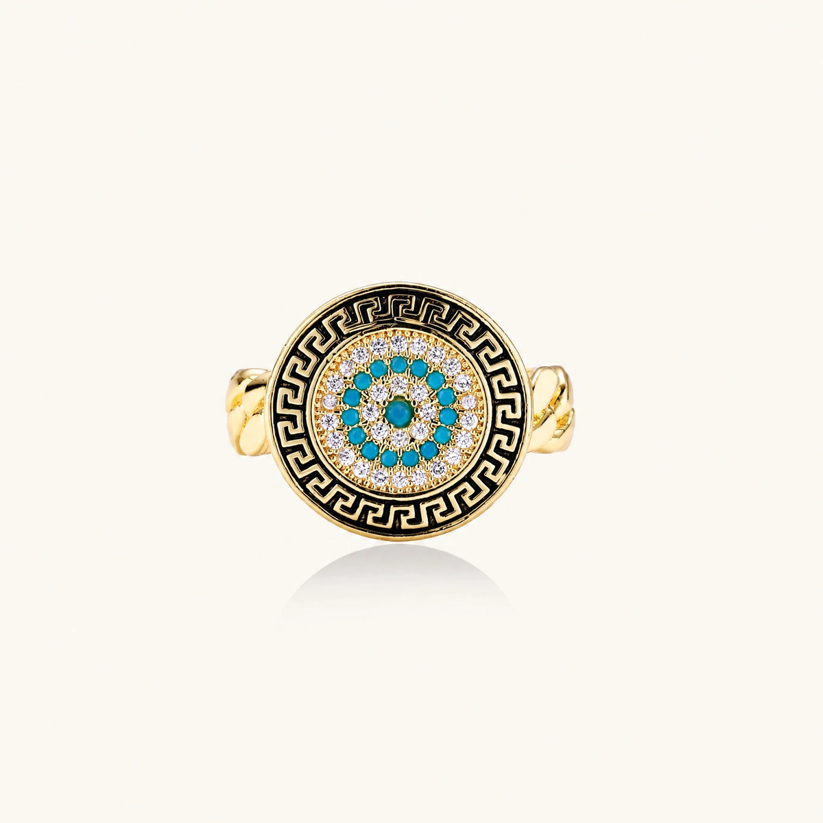 Gold chain ring with Greek key border and turquoise evil eye center on white background