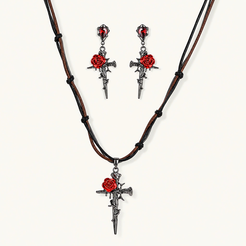 Gothic jewelry set with dark metal thorny cross pendants featuring red enamel roses and matching red crystal earrings