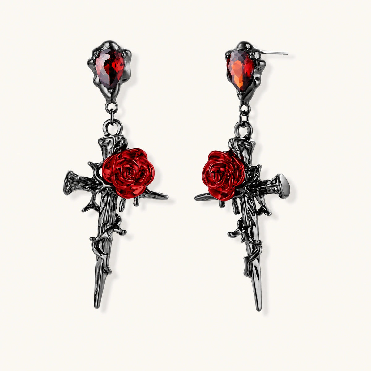 Gothic jewelry set with dark metal thorny cross pendants featuring red enamel roses and matching red crystal earrings