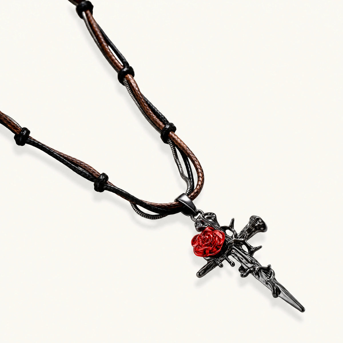 Gothic jewelry set with dark metal thorny cross pendants featuring red enamel roses and matching red crystal earrings